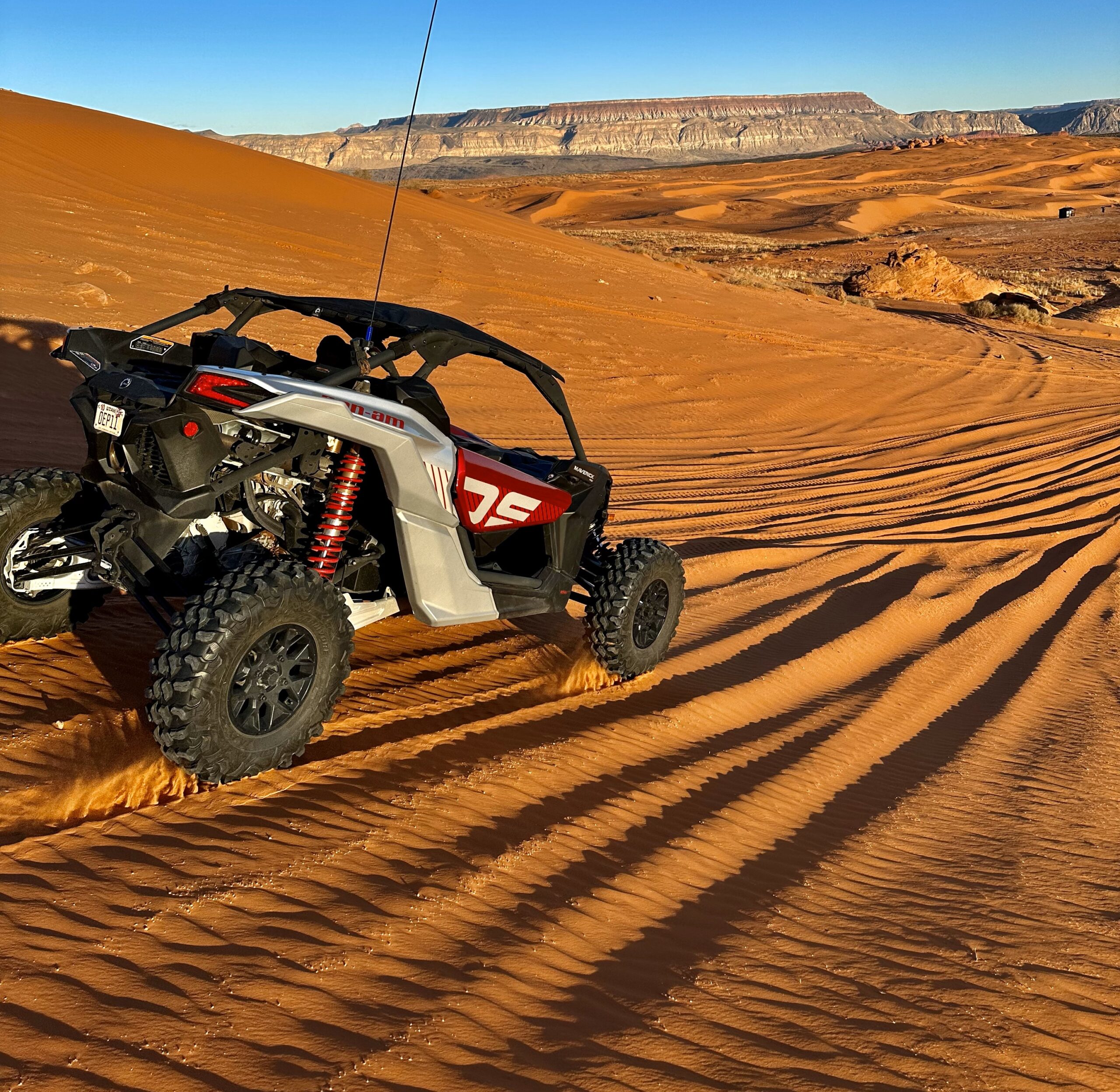 a motorcycle parked on the side of a dirt field