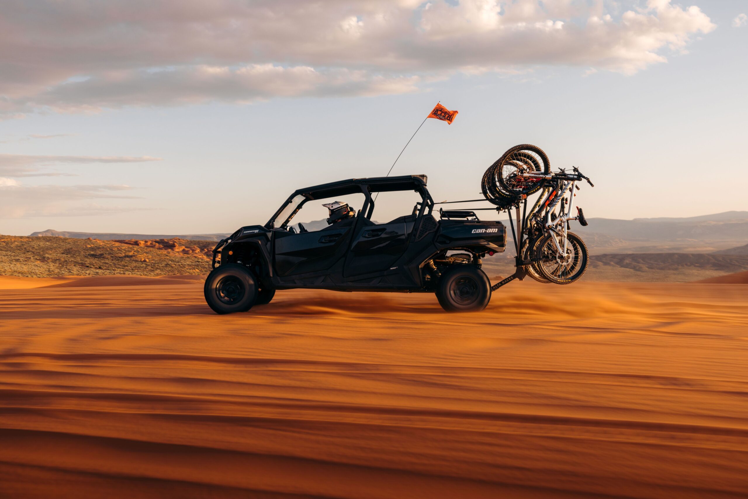 a person flying through the air while riding a motorcycle down a dirt road
